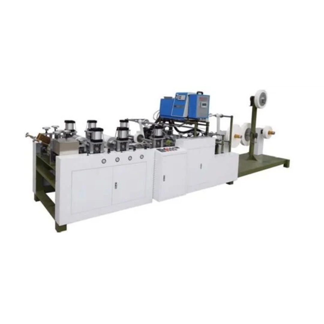 Máquina de Asas MAP-G-1 en proceso de fabricación de asas para bolsas de papel.